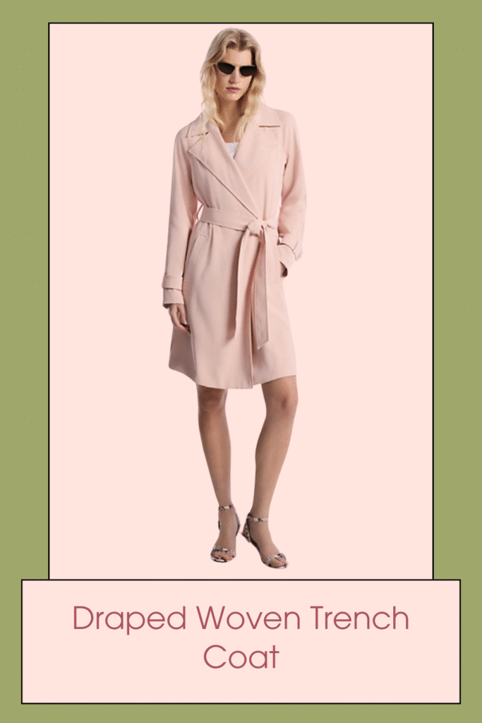 Renewed for the season, this trench coat features a single-breasted front and notch lapels that make it a classic, in addition to pockets and buttoned cuffs for a practical finish. The slightly loose, knee-length shape cinches with a self-tying belt.